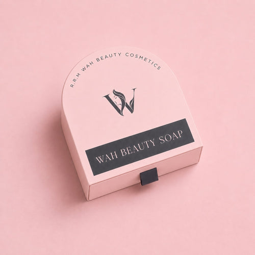 A pink cosmetic box for Wah Beauty Cosmetics Wah Beauty Soap, featuring a black logo and a black label with white text, set against a solid pink background.